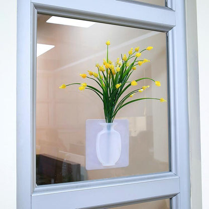 This is a removable silicone vase that can stick to any flat surface